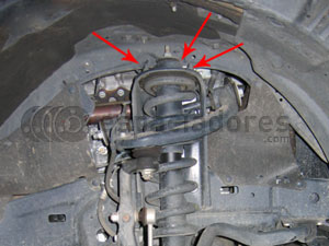Aflojar los 3 tornillos del conjunto muelle+amortiguador